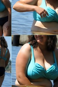 Young, overweight lady on bed, sensually touching herself