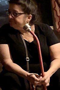 plump doll performing a sensual striptease with generous curves