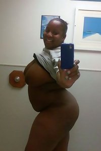 obscene plump lady seductively posing in lingerie